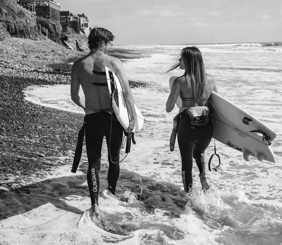 People Walking with Surfboards People Walking with Surfboards